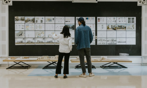 Two Asian architecture teacher discussion about student's final project work, how great they are, school of architecture and design
